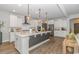 This bright kitchen features an island, stainless appliances and luxury vinyl plank flooring at 1546 Villena Dr., Myrtle Beach, SC 29579