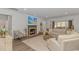 Cozy living room with fireplace and wainscotting detail and lots of natural light at 1546 Villena Dr., Myrtle Beach, SC 29579