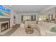 Comfortable living room featuring a fireplace and an open concept to the dining area at 1546 Villena Dr., Myrtle Beach, SC 29579