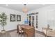Chic home office featuring a wooden desk, elegant decor, and French doors, ideal for productivity at 1546 Villena Dr., Myrtle Beach, SC 29579