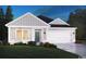 Charming single-story home featuring a two-car garage, gray siding, and a well-manicured lawn at 1562 Regal Fern Way, Longs, SC 29568