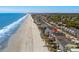 Aerial view of beach house with pool and ocean access at 1611B S Ocean Blvd., Surfside Beach, SC 29575