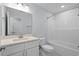 Clean bathroom with modern vanity, toilet, and bathtub with shower head at 1611B S Ocean Blvd., Surfside Beach, SC 29575