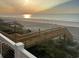 Scenic view of the beach and ocean at sunrise from the outdoor stairway at 1611B S Ocean Blvd., Surfside Beach, SC 29575