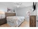 Comfortable bedroom with a large bed, ceiling fan, and natural light from the window at 1611B S Ocean Blvd., Surfside Beach, SC 29575