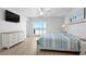 This light-filled bedroom includes ocean views and sliding glass doors to private balcony at 1611B S Ocean Blvd., Surfside Beach, SC 29575