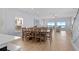 Bright dining room with seating for eight, showcasing ocean views and an open concept layout at 1611B S Ocean Blvd., Surfside Beach, SC 29575