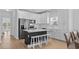Modern kitchen with stainless steel appliances and an island with barstool seating at 1611B S Ocean Blvd., Surfside Beach, SC 29575