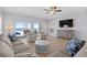 Relaxing living room with ocean view, comfortable seating and coastal decor, creating an inviting atmosphere at 1611B S Ocean Blvd., Surfside Beach, SC 29575