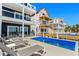 Backyard pool with lounge chairs offering a private oasis with stunning views of the neighborhood at 1611B S Ocean Blvd., Surfside Beach, SC 29575