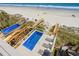 Aerial view of private backyard pool with lounge chairs and beach access at 1611B S Ocean Blvd., Surfside Beach, SC 29575