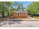 Exterior shot of a small home featuring a ramp, white shuttered windows, and street view at 1800 9Th Ave., Conway, SC 29527