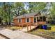 View of a single-story home featuring a ramp, surrounded by lush greenery at 1800 9Th Ave., Conway, SC 29527
