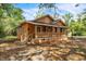 Charming single-story home featuring a welcoming front porch with wood railings and shuttered windows at 1800 9Th Ave., Conway, SC 29527