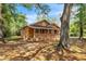 Charming single-story home with a welcoming front porch and mature trees, nestled on a spacious lot at 1800 9Th Ave., Conway, SC 29527
