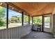 View of the screened in porch featuring screened in walls, wooden ceiling, and a view of the street at 1800 9Th Ave., Conway, SC 29527