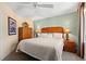 Bright bedroom features ceiling fan, side lamps and wardrobe at 215 77Th Ave. N # 807, Myrtle Beach, SC 29572