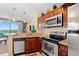 Well-equipped kitchen boasting granite countertops and stainless steel appliances at 215 77Th Ave. N # 807, Myrtle Beach, SC 29572