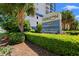 Eye-level shot of 'The Horizon at 77th' sign, surrounded by green foliage at 215 77Th Ave. N # 807, Myrtle Beach, SC 29572