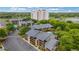 Aerial view showcasing condos surrounded by lush trees, with parking and a glimpse of the manicured golf course at 223 Maison Dr. # C7, Myrtle Beach, SC 29572