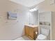 Neutral bathroom featuring a wood vanity, decorative wall hangings and built in shelving at 223 Maison Dr. # C7, Myrtle Beach, SC 29572