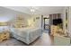 Bedroom with queen bed, ceiling fan, dresser and private porch access at 223 Maison Dr. # C7, Myrtle Beach, SC 29572