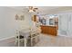Open dining and kitchen area featuring a breakfast bar and wood cabinets at 223 Maison Dr. # C7, Myrtle Beach, SC 29572