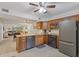 Open kitchen with granite countertops, stainless steel appliances, and view to the living room at 223 Maison Dr. # C7, Myrtle Beach, SC 29572