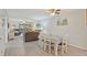 Open concept living and dining area with wood floors, comfortable seating, and access to outdoor space at 223 Maison Dr. # C7, Myrtle Beach, SC 29572