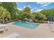 Refreshing community pool surrounded by lounge chairs and lush landscaping, perfect for relaxation and leisure at 223 Maison Dr. # C7, Myrtle Beach, SC 29572