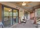Relaxing screened in porch with seating, and sliding glass door access at 223 Maison Dr. # C7, Myrtle Beach, SC 29572