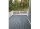 Spacious back deck with a wood-look floor and a view of the surrounding greenery at 223 S 9Th Ave. S, North Myrtle Beach, SC 29582