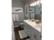 Modern bathroom featuring a double vanity, framed crab art, and a glass-enclosed shower at 223 S 9Th Ave. S, North Myrtle Beach, SC 29582