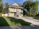 Inviting two-story home with a double porch, clean lines, and a spacious driveway at 223 S 9Th Ave. S, North Myrtle Beach, SC 29582