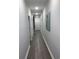 Bright hallway features hardwood floors, neutral paint, recessed lighting, and art accents at 223 S 9Th Ave. S, North Myrtle Beach, SC 29582