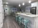 Open concept kitchen and living room with a large island, stainless appliances, and dining area at 223 S 9Th Ave. S, North Myrtle Beach, SC 29582