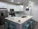 Modern kitchen featuring a large island with granite countertops, stainless steel appliances, and white cabinetry at 223 S 9Th Ave. S, North Myrtle Beach, SC 29582