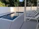 Sparkling swimming pool with lounge chairs, surrounded by privacy fencing and lush greenery at 223 S 9Th Ave. S, North Myrtle Beach, SC 29582