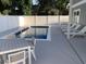Backyard pool area featuring a pool with tables and chaise lounges for relaxing by the water at 223 S 9Th Ave. S, North Myrtle Beach, SC 29582