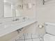 Clean bathroom features a white vanity, toilet, and well-lit mirror with tiled floors at 2300 N Ocean Blvd. # 1430, Myrtle Beach, SC 29577