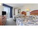 Cozy bedroom with two queen beds, lamps, and decor for a relaxed atmosphere, plus balcony access and a mini-kitchen at 2300 N Ocean Blvd. # 1430, Myrtle Beach, SC 29577