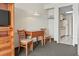 Small dining area with a light fixture and kitchen area in background at 2300 N Ocean Blvd. # 1430, Myrtle Beach, SC 29577