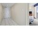 Hallway leading to the room entrance, with a neutral color scheme, tile flooring, and a door for added security at 2300 N Ocean Blvd. # 1430, Myrtle Beach, SC 29577