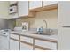 Bright kitchen showcasing essential appliances, ample counter space, and white cabinets at 2300 N Ocean Blvd. # 1430, Myrtle Beach, SC 29577