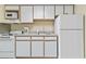 Bright kitchen showcasing essential appliances, ample counter space, and white cabinets at 2300 N Ocean Blvd. # 1430, Myrtle Beach, SC 29577