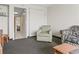 Living area with sofa, chair, tv, and bed at 2300 N Ocean Blvd. # 1430, Myrtle Beach, SC 29577