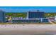 Aerial view showcases a beachfront resort featuring pools, palm trees, and direct access to the ocean at 2301 S Ocean Blvd. # 130, Myrtle Beach, SC 29577