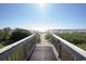 Direct beach access on wooden walkway perfect for enjoying ocean breezes at 2301 S Ocean Blvd. # 130, Myrtle Beach, SC 29577