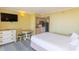 Comfortable bedroom with a cozy dining area, television, and a compact kitchenette, perfect for relaxed living at 2301 S Ocean Blvd. # 130, Myrtle Beach, SC 29577