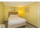 Cozy bedroom with a serene ambiance, featuring a comfortable bed and seascape artwork for a relaxing retreat at 2301 S Ocean Blvd. # 130, Myrtle Beach, SC 29577